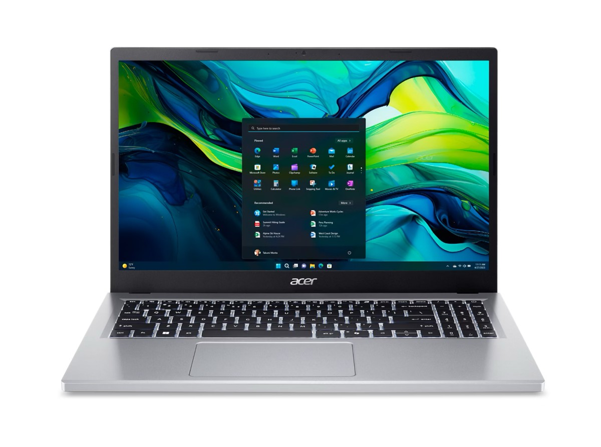 The silver Acer Aspire Go 15 facing forward, open with the Windows 11 start menu over a blue and green wallpaper