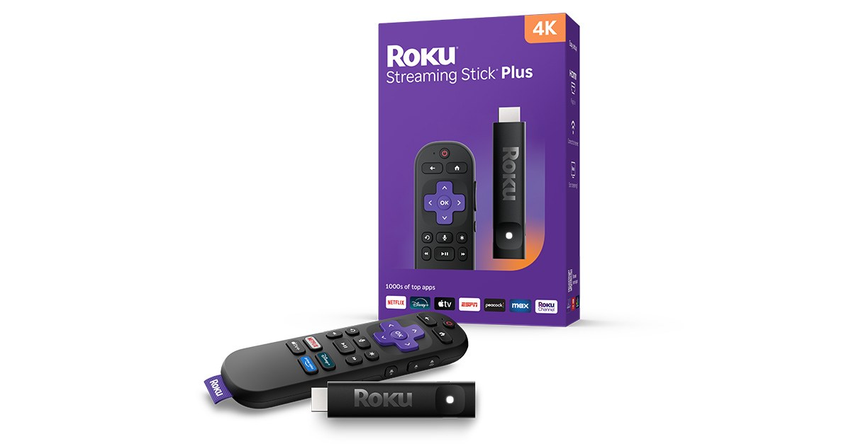 Roku Streaming Stick Plus with its voice remote in front of the purple retail box