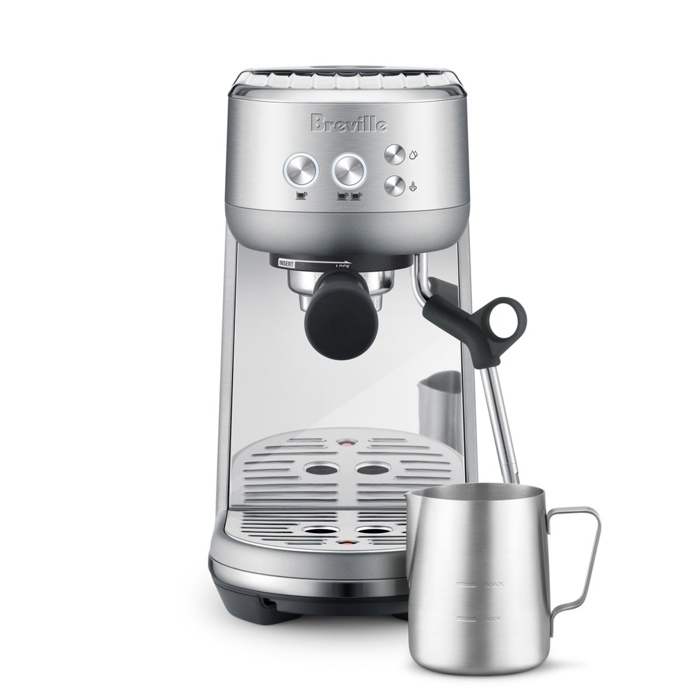 Breville Bambino, a compact brushed stainless espresso machine with a steam wand and milk pitcher