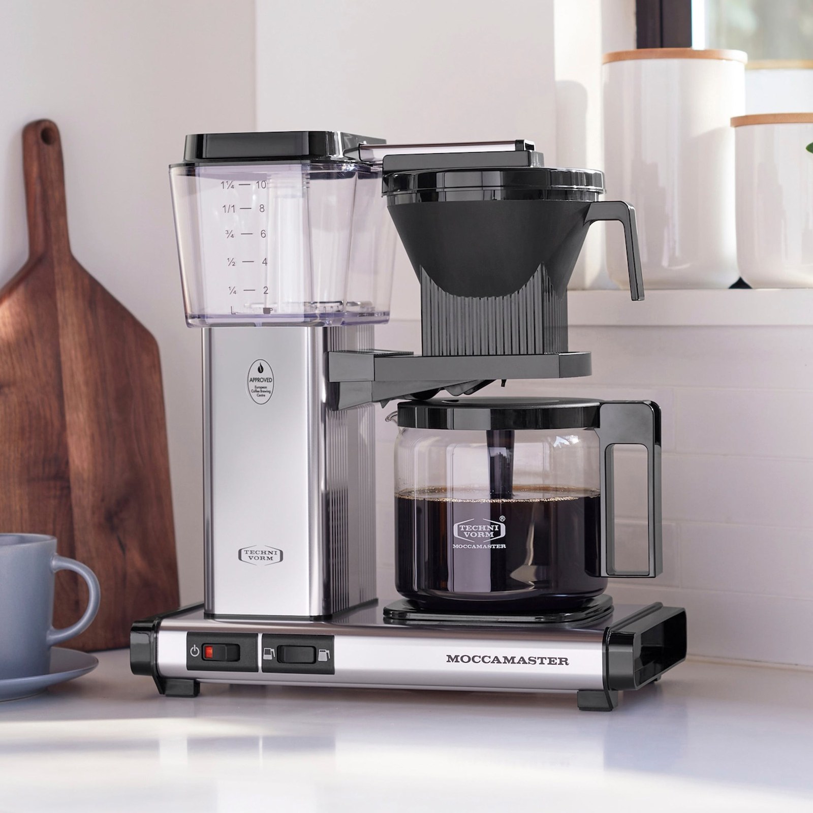 Moccamaster KBGV Select in polished silver on a kitchen counter, with the oval European Coffee Brewing Centre approval badge printed on its tower
