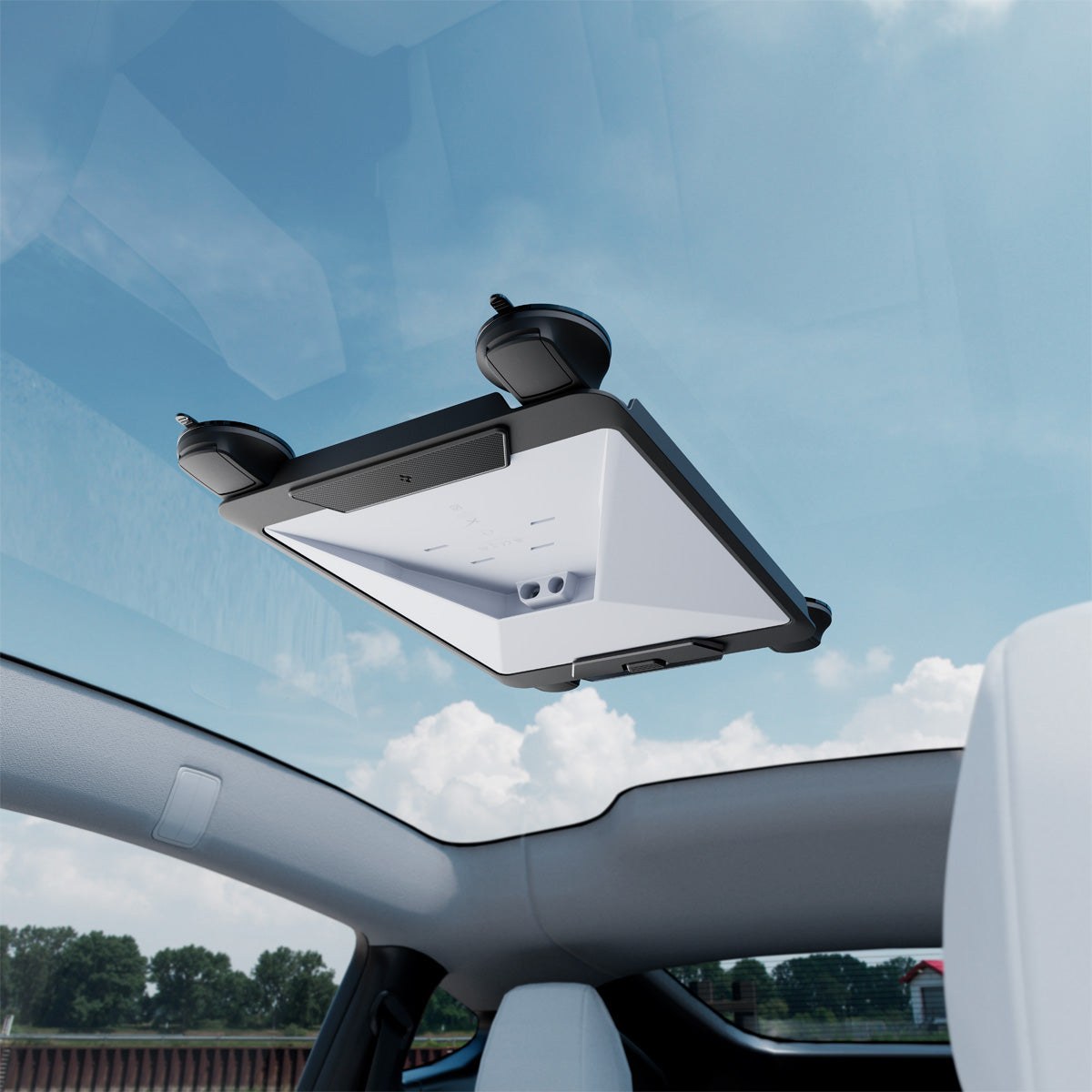 A Starlink Mini held under the glass roof of a car by the Spigen mount's suction cups, seen from the back seat