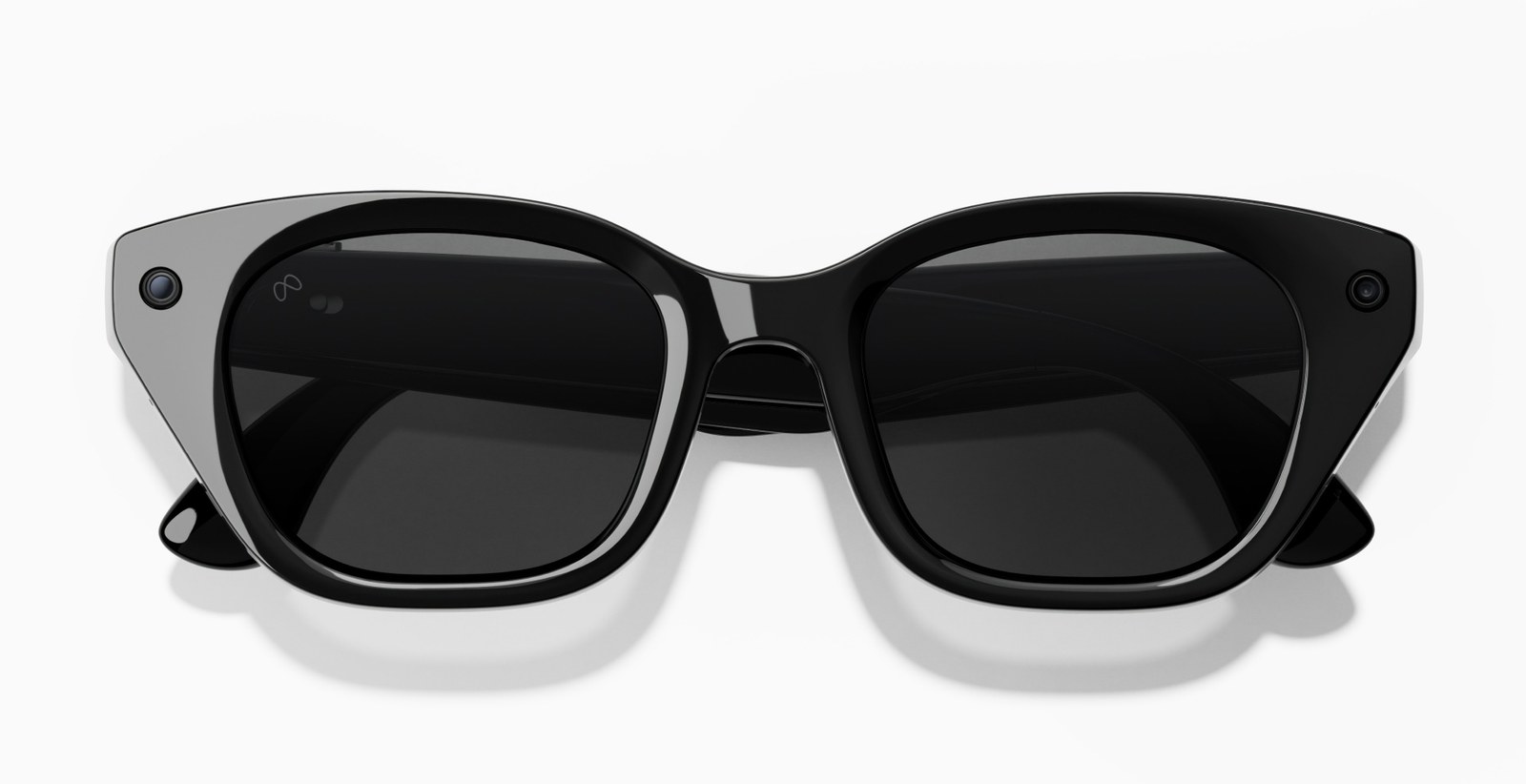 Meta Glasses cat-eye frame in black with dark lenses, seen from the front with a camera lens in one corner
